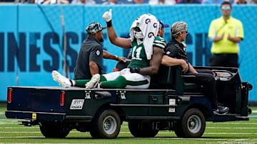 New York Jets linebacker Jermaine Johnson (11) exits the field after an injury during the third quarter against the Tennessee Titans at Nissan Stadium in Nashville, Tenn., Sunday, Sept. 15, 2024.
