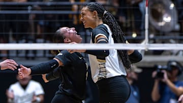 Purdue sophomore Ryan McAleer (3) and senior Akasha Anderson (13) celebrate 