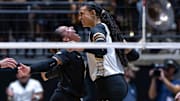 Purdue sophomore Ryan McAleer (3) and senior Akasha Anderson (13) celebrate after a point