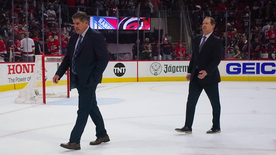 May 16, 2024; Raleigh, North Carolina, USA; New York Rangers head coach Peter Laviolette and assistant coach Phil Housley walk off the ice after the 1st period against the Carolina Hurricanes in game six of the second round of the 2024 Stanley Cup Playoffs at PNC Arena. Mandatory Credit: James Guillory-Imagn Images