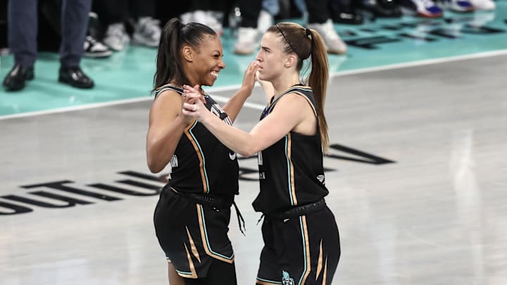 Oct 13, 2024; Brooklyn, New York, USA; New York Liberty forward Betnijah Laney-Hamilton (44) and guard Sabrina Ionescu (20) celebrate in the fourth quarter against the Minnesota Lynx during game two of the 2024 WNBA Finals at Barclays Center. Mandatory Credit: Wendell Cruz-Imagn Images