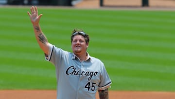 Former Chicago White Sox pitcher Bobby Jenks throws out the ceremonial first pitch prior to the first inning against the Baltimore Orioles at U.S Cellular Field on July 4, 2015.