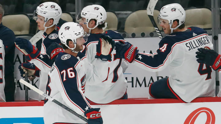 Sep 24, 2023; Pittsburgh, Pennsylvania, USA;  Columbus Blue Jackets center Owen Sillinger (76) celebrates with Cole Sillinger (4) after Owen scored a goal against the Pittsburgh Penguins during the third period at PPG Paints Arena. Mandatory Credit: Charles LeClaire-USA TODAY Sports