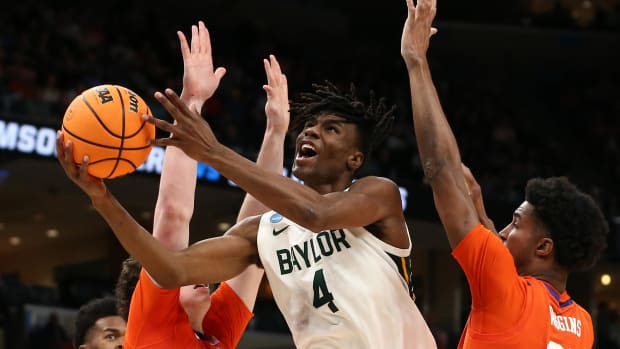 Mar 24, 2024; Memphis, TN, USA; Baylor Bears guard Ja'Kobe Walter (4) shoots against Clemson Tigers forward Ian Schieffelin (4) and forward Chauncey Wiggins (21) in the second half in the second round of the 2024 NCAA Tournament at FedExForum. Mandatory Credit: Petre Thomas-USA TODAY Sports