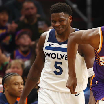 Anthony Edwards looks on as Kevin Durant runs down the court during a Timberwolves-Suns matchup in January.