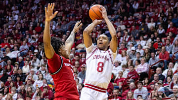 Indiana Hoosiers forward Bryson Tucker (8) shoots the ball while Rutgers Scarlet Knights guard Jamichael Davis (1) defends in the first half at Simon Skjodt Assembly Hall.