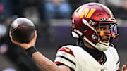 Washington Commanders quarterback Jayden Daniels drops back to pass against the Minnesota Vikings.
