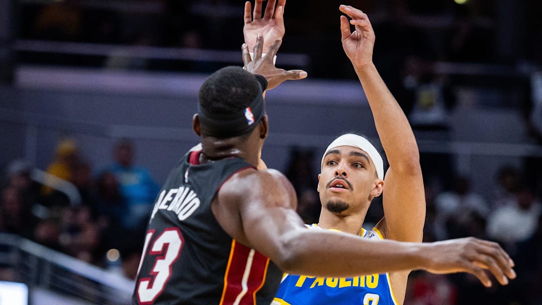 Mar 29, 2026; Indianapolis, Indiana, USA; Indiana Pacers guard Andrew Nembhard (2) shoots the ball while Miami Heat center Bam Adebayo (13) defends in the first half at Gainbridge Fieldhouse. Mandatory Credit: Trevor Ruszkowski-Imagn Images