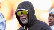 Nov 23, 2024; Kansas City, Missouri, USA;  Colorado head coach Deion Sanders watches his players warmup prior to the game between the Kansas Jayhawks and the Colorado Buffaloes at GEHA Field at Arrowhead Stadium. Mandatory Credit: Nick Tre. Smith-Imagn Images