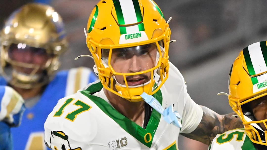 Sep 28, 2024; Pasadena, California, USA; Oregon Ducks wide receiver Tez Johnson (15) celebrates scoring against the UCLA Bruins with teammate Kyler Kasper (17) during the third quarter at Rose Bowl. Mandatory Credit: Robert Hanashiro-Imagn Images