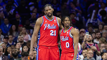 Apr 12, 2024; Philadelphia, Pennsylvania, USA; Philadelphia 76ers center Joel Embiid (21) and guard Tyrese Maxey (0) stand together during a break in action in the fourth quarter against the Orlando Magic at Wells Fargo Center. Mandatory Credit: Bill Streicher-Imagn Images