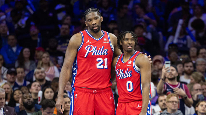 Apr 12, 2024; Philadelphia, Pennsylvania, USA; Philadelphia 76ers center Joel Embiid (21) and guard Tyrese Maxey (0) stand together during a break in action in the fourth quarter against the Orlando Magic at Wells Fargo Center. Mandatory Credit: Bill Streicher-USA TODAY Sports