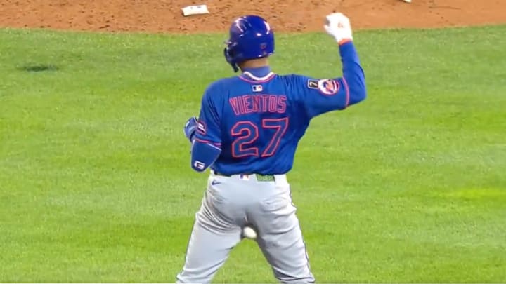 Mark Vientos gets hit in the backside by an errant throw. Mark Vientos gets hit in the backside by an errant throw.