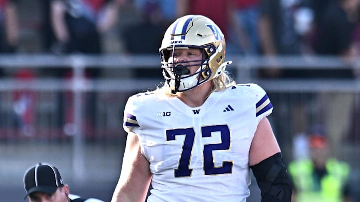 Sep 20, 2025; Pullman, Washington, USA; Washington Huskies offensive lineman John Mills (72) walks up the field after a play against the Washington State Cougars in the first half of Apple Cup at Gesa Field at Martin Stadium. Mandatory Credit: James Snook-Imagn Images