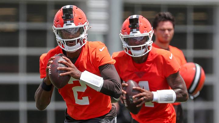 Cleveland Browns quarterback Shedeur Sanders, left, and Deshaun Watson