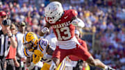 LSU Tigers running back Caden Durham (29) is bumped out off bounds by Arkansas Razorbacks defensive back Kani Walker (13) during the second half at Tiger Stadium.