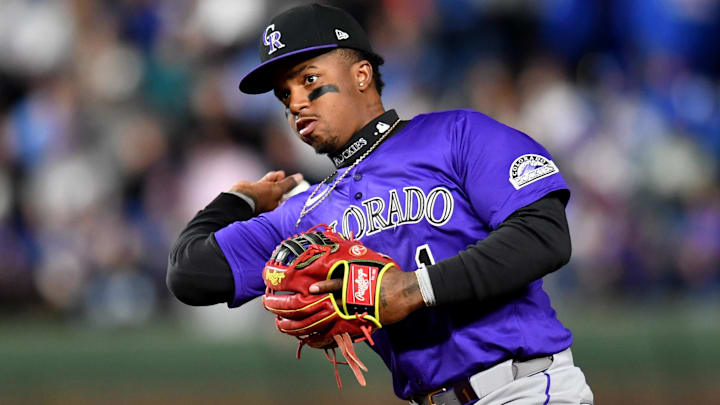 Colorado Rockies second baseman Adael Amador (1) throws to first base during a game against the Chicago Cubs at Wrigley Field. 