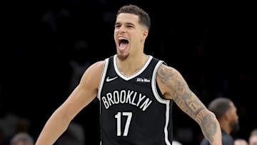 Dec 1, 2025; Brooklyn, New York, USA; Brooklyn Nets forward Michael Porter Jr. (17) reacts with guard Egor Demin (8) during the fourth quarter against the Charlotte Hornets at Barclays Center. Mandatory Credit: Brad Penner-Imagn Images