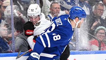 Mar 15, 2025; Toronto, Ontario, CAN;  Toronto Maple Leafs forward Steven Lorentz (18) bodychecks Ottawa Senators defenseman Thomas Chabot (72) in the third period at Scotiabank Arena. Mandatory Credit: Dan Hamilton-Imagn Images