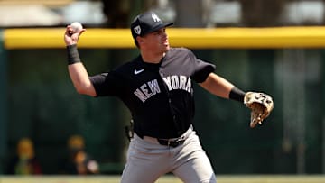 Mar 24, 2024; Bradenton, Florida, USA; New York Yankees infielder Caleb Durbin (87)  throws the ball for an out during the second inning against the Pittsburgh Pirates at LECOM Park. Mandatory Credit: Kim Klement Neitzel-Imagn Images