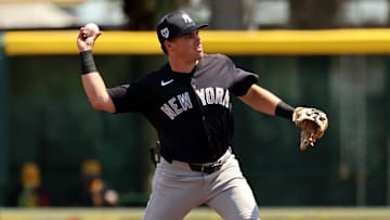 Mar 24, 2024; Bradenton, Florida, USA; New York Yankees infielder Caleb Durbin (87)  throws the ball for an out during the second inning against the Pittsburgh Pirates at LECOM Park. Mandatory Credit: Kim Klement Neitzel-Imagn Images