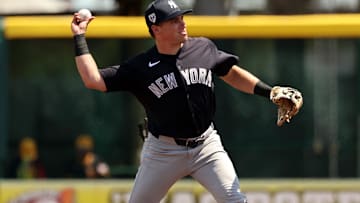 Mar 24, 2024; Bradenton, Florida, USA; New York Yankees infielder Caleb Durbin (87)  throws the ball for an out during the second inning against the Pittsburgh Pirates at LECOM Park. Mandatory Credit: Kim Klement Neitzel-Imagn Images