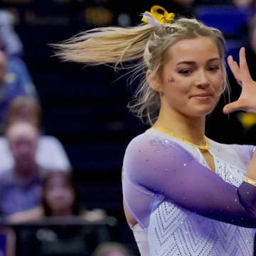 Feb 2, 2024; Baton Rouge, LA, USA;  LSU Lady Tigers senior Olivia \"Livvy\" Dunne performs a floor routine against the Arkansas Razorbacks at Pete Maravich Assembly Center.