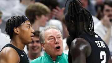Dec 13, 2025; University Park, Pennsylvania, USA; Michigan State Spartans head coach Tom Izzo talks with guard Jeremy Fears Jr (1) and guard Kur Teng (2) during the second half against the Penn State Nittany Lions at Bryce Jordan Center. Mandatory Credit: Matthew O'Haren-Imagn Images