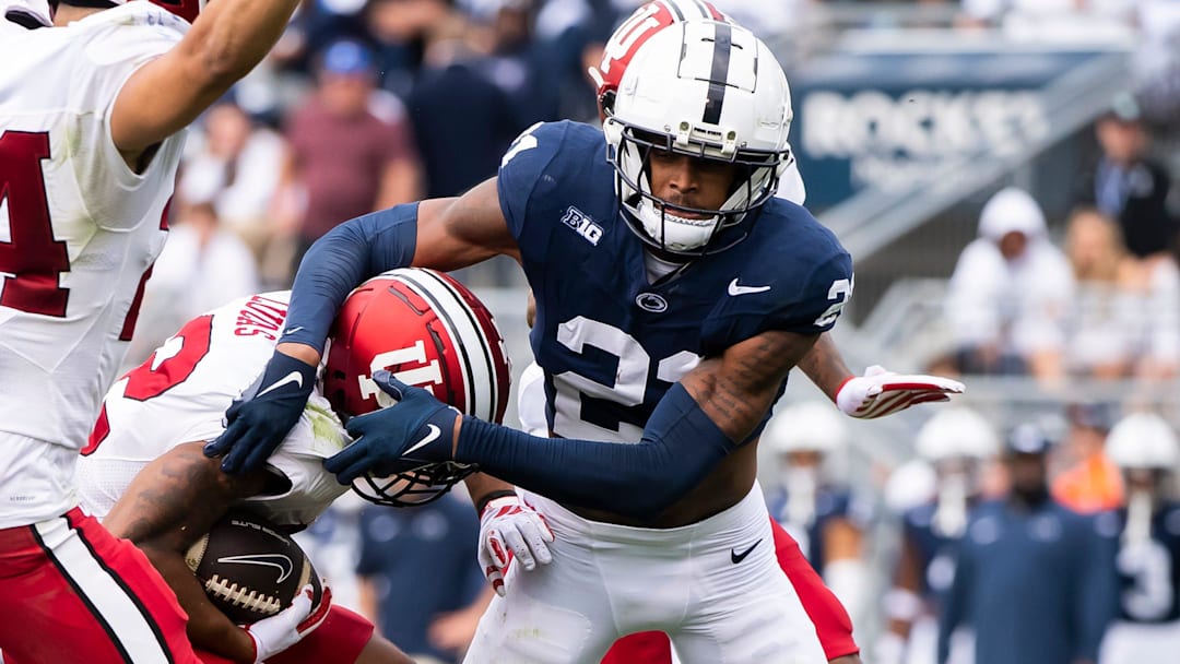 Penn State's Kevin Winston Jr. (21) tackles Indiana's Jaylin Lucas during a kickoff return in the second half of an NCAA football game at Beaver Stadium Saturday, Oct. 28, 2023, in State College, Pa. The Nittany Lions won, 33-24.