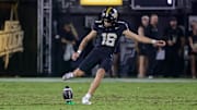 Sep 6, 2025; Orlando, Florida, USA; UCF Knights place kicker Noe Ruelas (16) kicks off during the second quarter against the North Carolina A&T Aggies at Acrisure Bounce House. Mandatory Credit: Mike Watters-Imagn Images