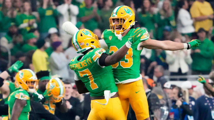 Oregon Ducks defensive back Steve Stephens IV (7) reacts after intercepting a pass against the Liberty Flames in the first half during the Fiesta Bowl at State Farm Stadium in Glendale on Jan. 1, 2024.