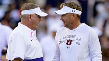 Oct 14, 2023; Baton Rouge, Louisiana, USA; LSU Tigers head coach Brian Kelly, left, talks with Auburn Tigers head coach Hugh Freeze before the game at Tiger Stadium.