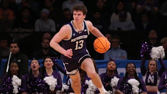 March 22, 2024, Brooklyn, NY, USA; Northwestern Wildcats guard Brooks Barnhizer (13) controls the ball against the Florida Atlantic Owls in the first round of the 2024 NCAA Tournament at the Barclays Center. Mandatory Credit: Brad Penner-Imagn Images