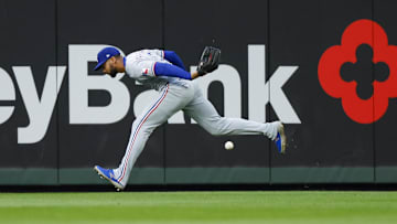 Apr 12, 2025; Seattle, Washington, USA; Texas Rangers center fielder Leody Taveras (3) fails to field a triple against the Seattle Mariners during the third inning at T-Mobile Park. 