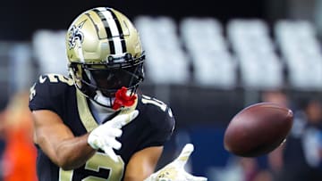 Sep 15, 2024; Arlington, Texas, USA;  New Orleans Saints wide receiver Chris Olave (12) warms up before the game against the Dallas Cowboys at AT&T Stadium. Mandatory Credit: Kevin Jairaj-Imagn Images