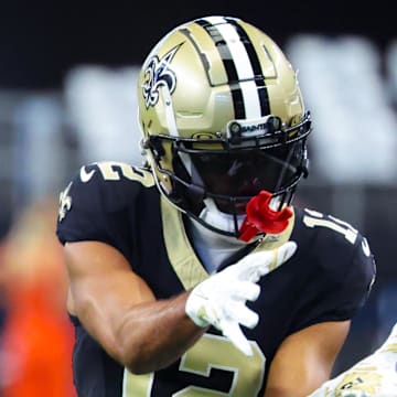 Sep 15, 2024; Arlington, Texas, USA;  New Orleans Saints wide receiver Chris Olave (12) warms up before the game against the Dallas Cowboys at AT&T Stadium. Mandatory Credit: Kevin Jairaj-Imagn Images