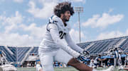 JUCO transfer Kenton Simmons stretching before FIU football spring game