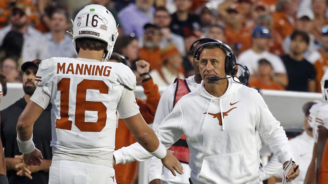 Texas Longhorns head coach Steve Sarkisian reacts with Texas Longhorns quarterback Arch Manning (16)