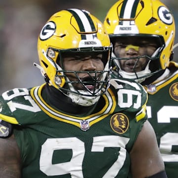 Green Bay Packers defensive tackle Kenny Clark (97) celebrates sacking Miami Dolphins quarterback Tua Tagovailoa. It was his only sack of the season.