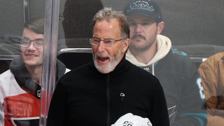 Dec 31, 2024; San Jose, California, USA; Philadelphia Flyers head coach John Tortorella reacts to game play against the San Jose Sharks as right wing Matvei Michkov (39), left wing Joel Farabee (86) and center Sean Couturier (14) watch the play during the third period at SAP Center at San Jose. Mandatory Credit: Robert Edwards-Imagn Images