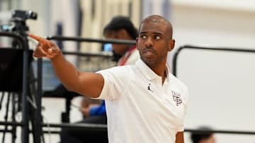 NBA player Chris Paul looks on as Team CP3 plays a game against Nightrydas at Nike EYBL.