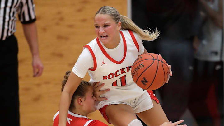 Neenah High School's Rowan Klesmit (11) drives through the lane during a girls basketball game Friday, December 6, 2024.