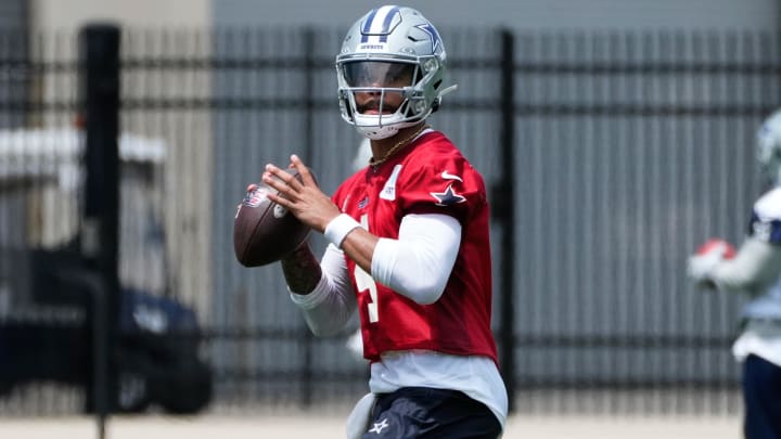 Jun 5, 2024; Frisco, TX, USA;  Dallas Cowboys quarterback Dak Prescott (4) goes through a drill during practice at the Ford Center at the Star Training Facility in Frisco, Texas. Mandatory Credit: Chris Jones-USA TODAY Sports