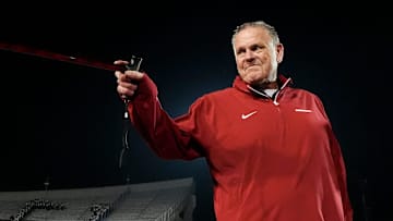 Arkansas' head coach Sam Pittman points to his players and Arkansas fans with his cane after Arkansas defeated Texas Tech 36-26 in the AutoZone Liberty Bowl in Memphis, Tenn., on Friday, December 27, 2024.