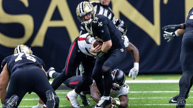 Atlanta Falcons linebacker Lorenzo Carter (9) sacks New Orleans Saints quarterback Andy Dalton (14) 