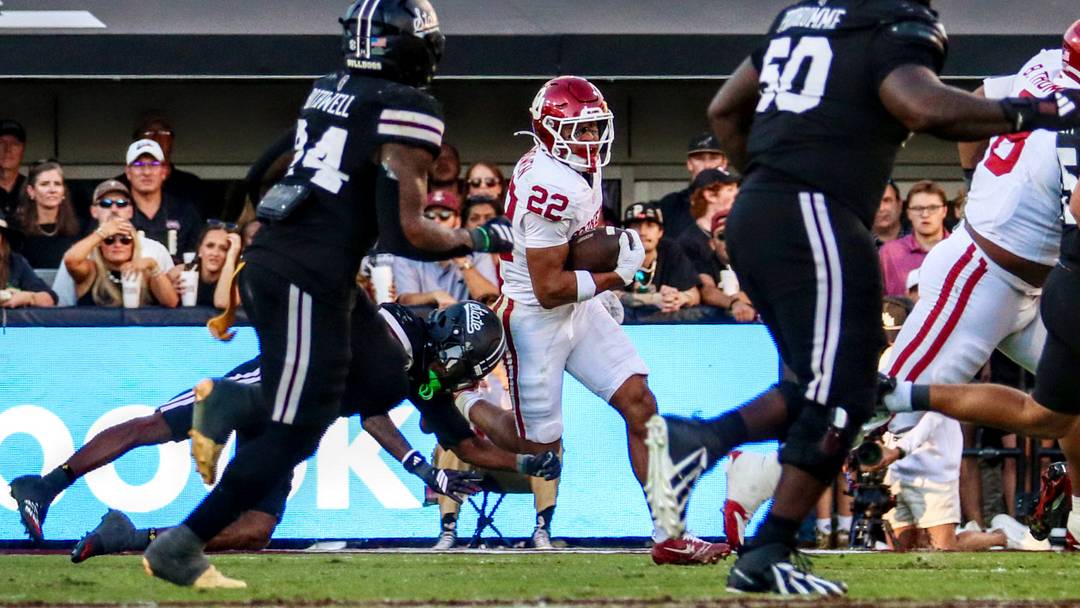 Oklahoma defensive back Peyton Bowen tries to return an interception against Mississippi State.