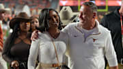 Texas Longhorns head coach Steve Sarkisian and his wife Loreal Sarkisian walk off the field after winning 31-14 against Kentucky Wildcats during the first half of an NCAA college football game.