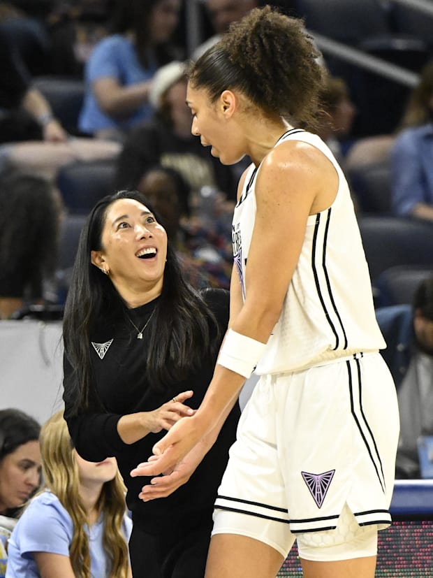 Golden State Valkyries head coach Natalie Nakase talks with forward Janelle Salaun.