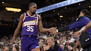 Oct 6, 2024; Palm Desert, California, USA; Phoenix Suns forward Kevin Durant (35) high fives with teams after subbing out against the Los Angeles Lakers during the first half at Acrisure Arena. Mandatory Credit: David Frerker-Imagn Images