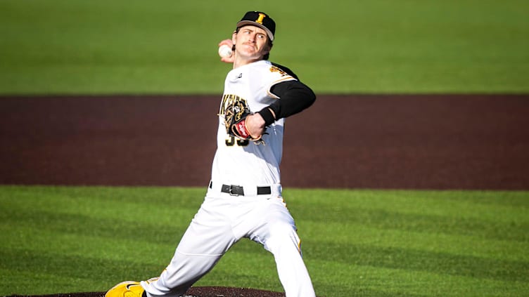 Iowa's Adam Mazur (33) delivers a pitch during a NCAA Big Ten Conference baseball game against